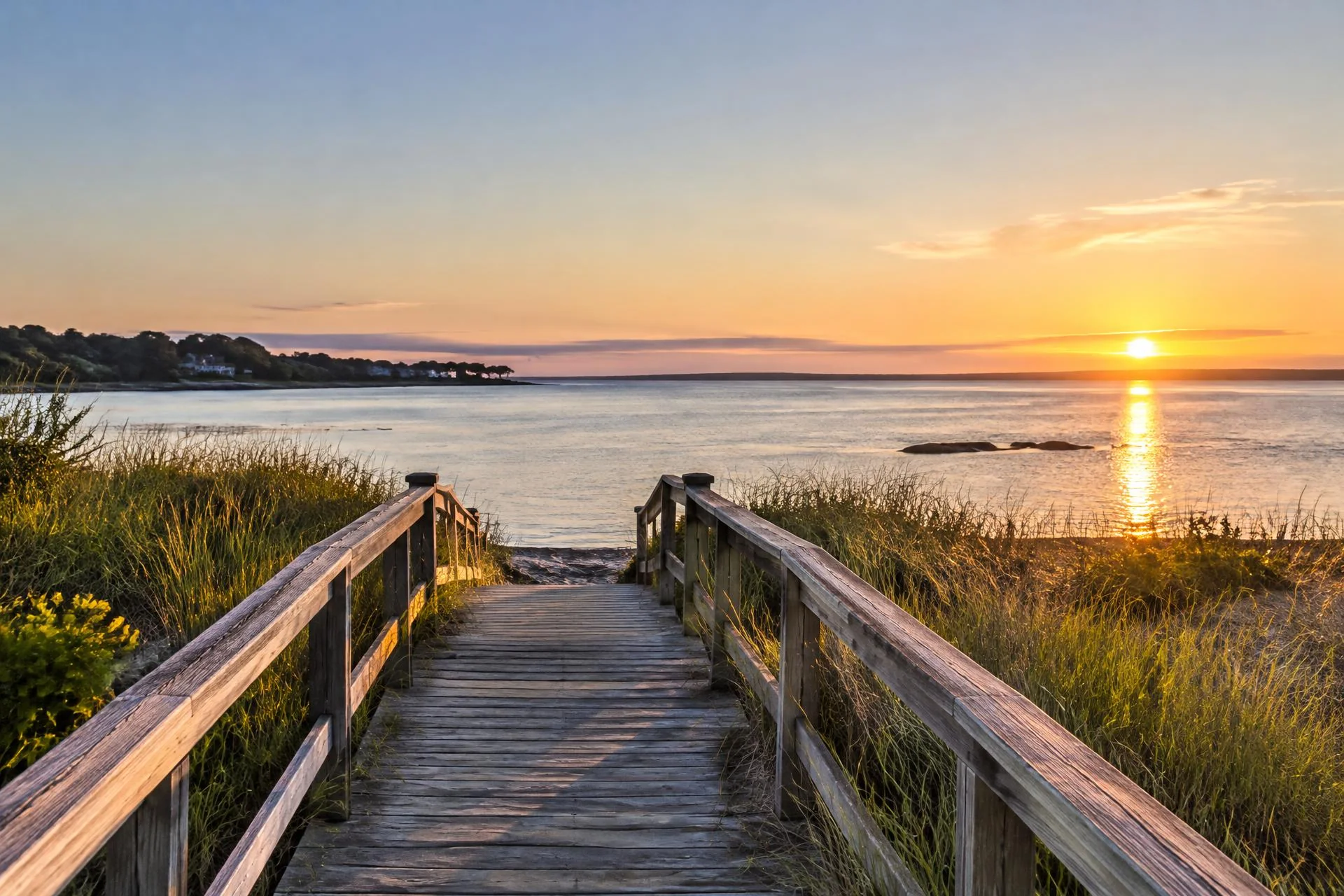 A quiet Long Island bay and boardwalk at sunrise representing careful withdrawal planning.